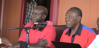 Canon Andrew Nyote (R), the UPC Electoral Commission (EC) Chairperson addressing a press conference.