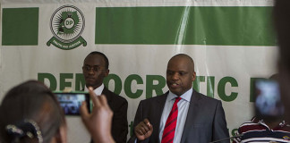 Democratic Party Spokesperson, Kenneth Paul Kakande (R) address the media at the head quarters during the party’s press conference on April 21, 2015. PHOTO BY ISAAC KASAMANI