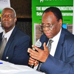 Gabriel Opio Chairman Scholarship Committee addresses members of