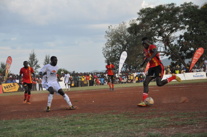 Uganda Cranes Joseph Ochaya dribbles the ball towards the opponent in the Masindi regional tour match last year.