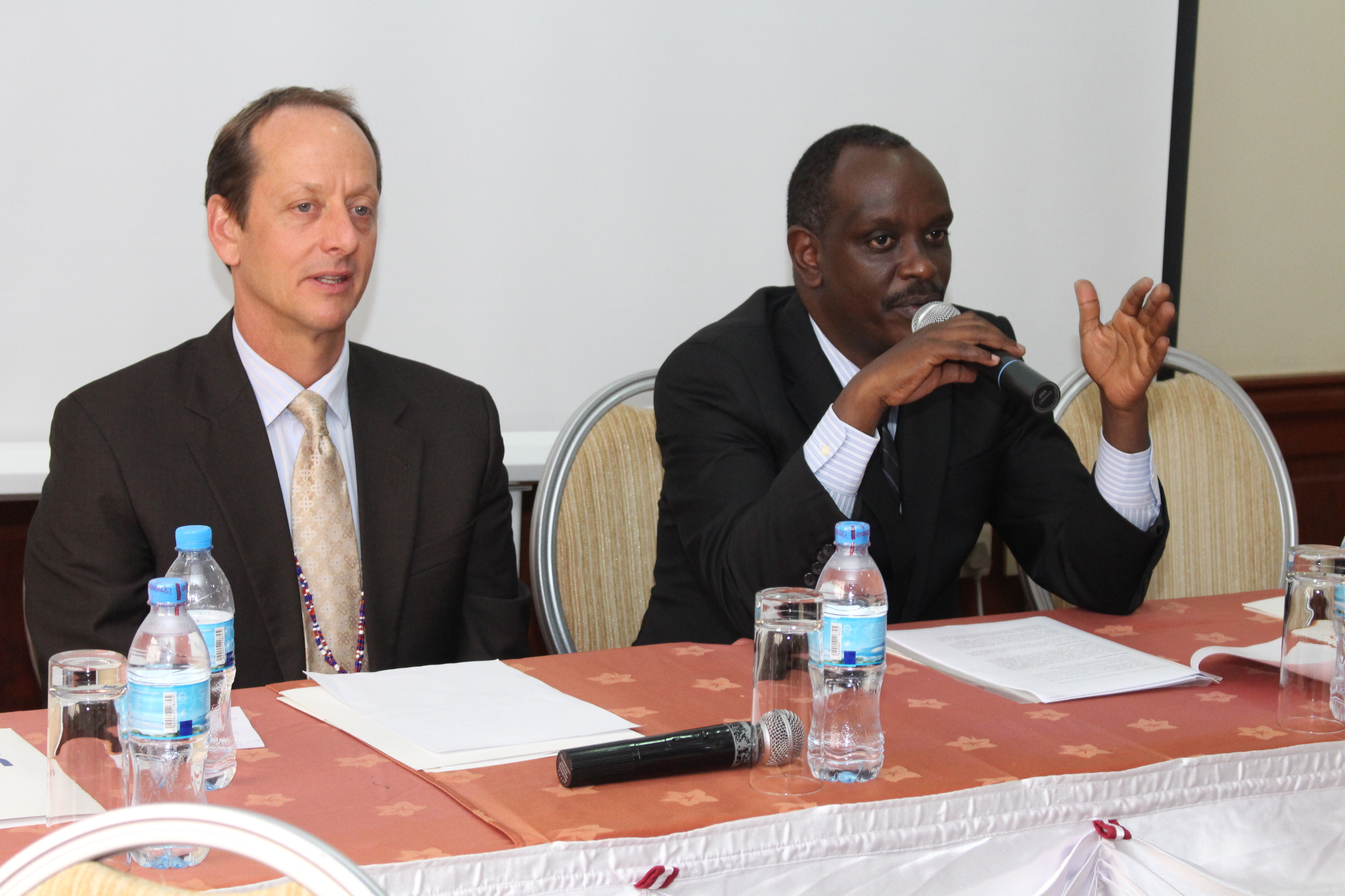 The EAC Secretary General, Amb. Dr. Richard Sezibera make his remarks during the official opening session as Mr. Matthew Rees, USAID/Kenya and East Africa/Regional Economic Integration Office Director looks on