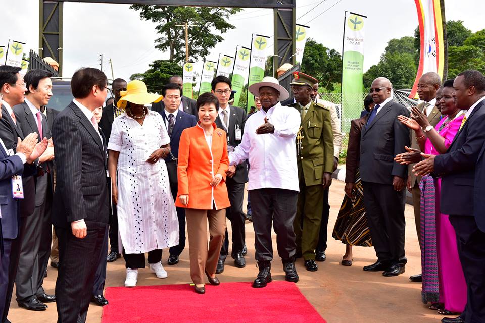 South Korea president Park Geun-hye (Centre) being given a tour around Centre at Kampiringisa by President Museveni and wife Janet Museveni on Monday