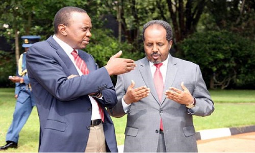 Presidents Uhuru Kenyatta and Hassan Mohamud share a light moment. Photo credit/biyokulule.com