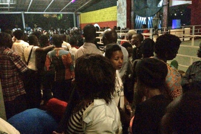 Crowds at the Mr and Miss Pride Uganda pageant are detained by police.