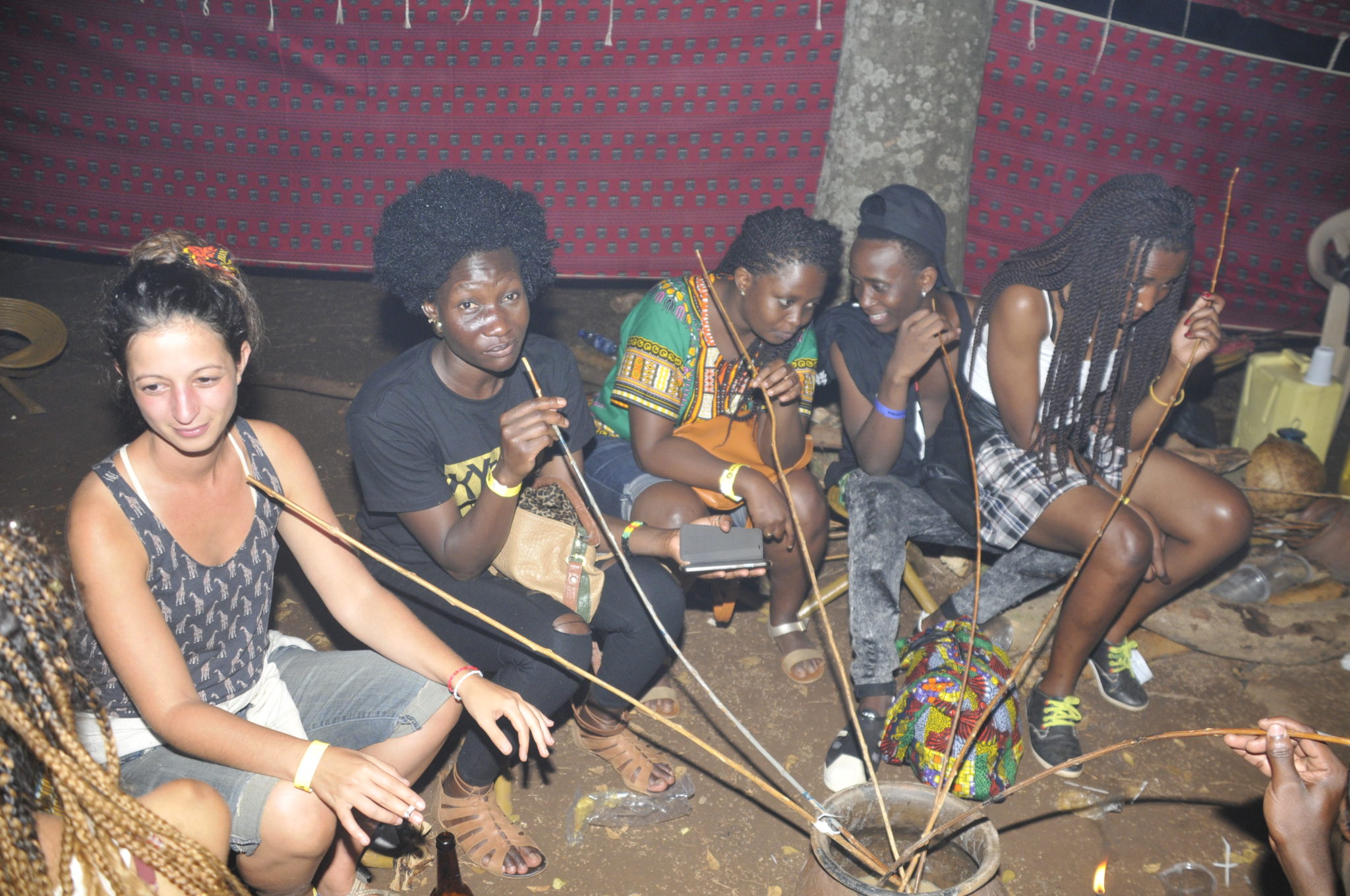 MALWA? Revellers enjoy a drink in a pot, simulating a popular local brew