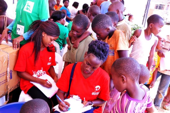 Airtel Uganda staff members register sick children at the recently concl...