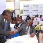 Chairman dfcu Bank Jimmy D. Mugerwa shares a moment with State minister for