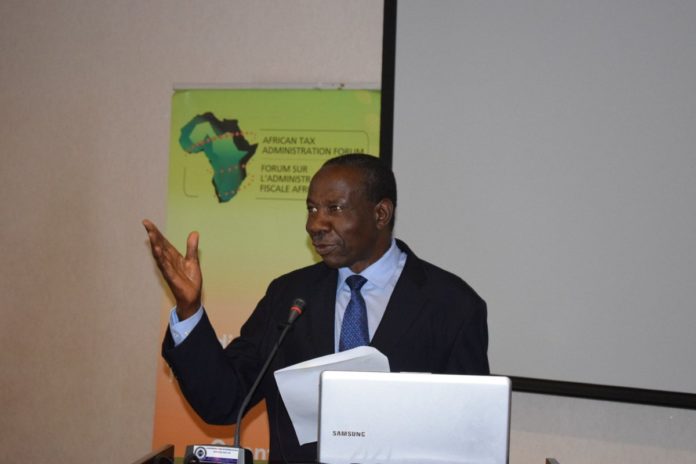 Matia Kasaija addressing participants