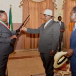 THE MAYOR OF MONGOM TOWN MR. SANTIAGO ENEME OVONO HANDING A SIMBOLIC GUN TO PRESIDENT M7 WHEN HE VISITED HIS OFFICE AT MONGOMO