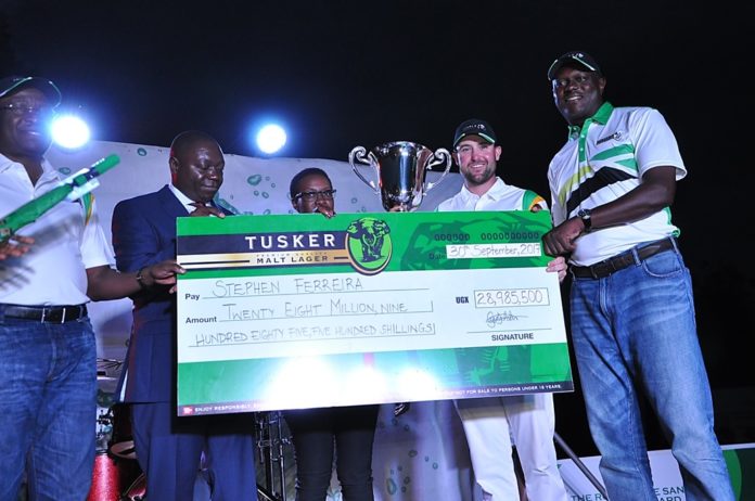 Stephen Ferreira being handed the trophy and cheque during the awards ceremony