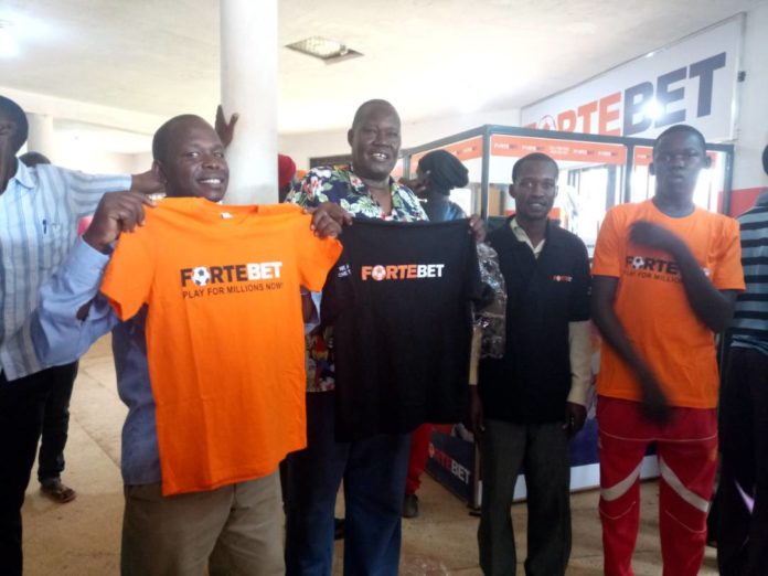 Happy clients at Bukedea branch that got T-shirts