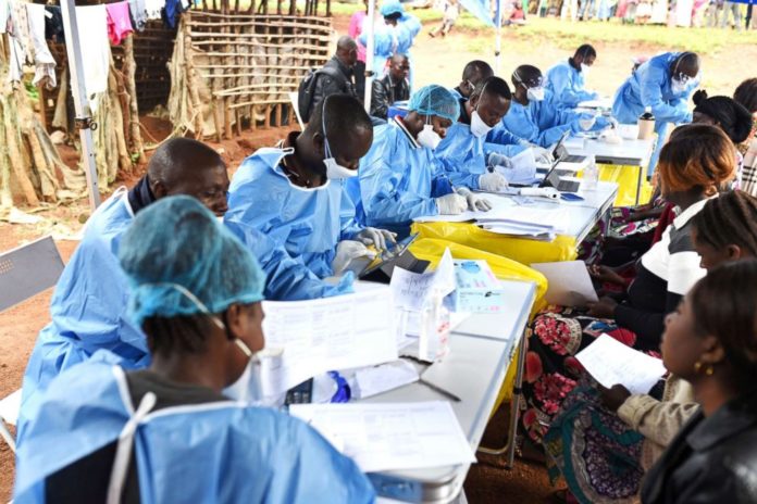 DRC health officials attend to clients