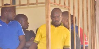 Abdallah Kitatta, the Boda Boda 2010 Association patron and his bodyguard Sowali Ngobi . Photo Credit: The Observer