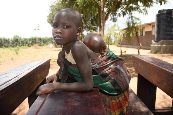 Hunger Crisis: Children in Karamoja take younger siblings to school for ...