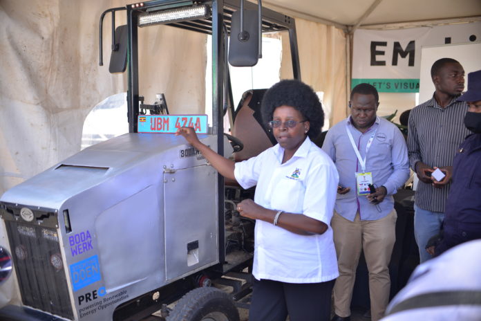 Dr. Musenero speaking to guests about the Bodawerk E-Trak (Electric tractor)