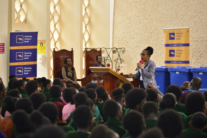 Peace Ayebazibwe, Executive Director at Housing Finance Bank addresses Gayaza High School students as Robinah Kizito, the Head Teacher observes
