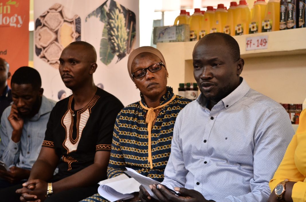 R-L; Joseph Mudhasi, Chairman Nakawa Market, Zuena Nantume Market Master Wandegeya and Richard Mugisha JERO FARMS interact with media at Entebbe Kitoro market