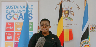 Minister of General Duties, Justine Lumumba is addressing the Press