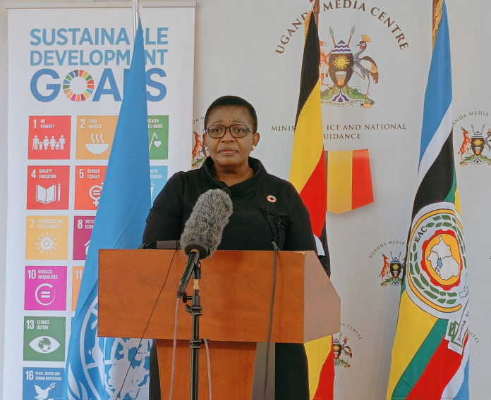 Minister of General Duties, Justine Lumumba is addressing the Press