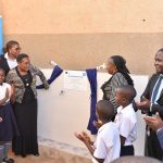 The headmistress Ms. Margret Nabakooza (3rd Left) of St.Joseph nursery and primary school Nansana together with officials from Housing Finance Bank and WaterQuip commissioning a water purification syste (1)